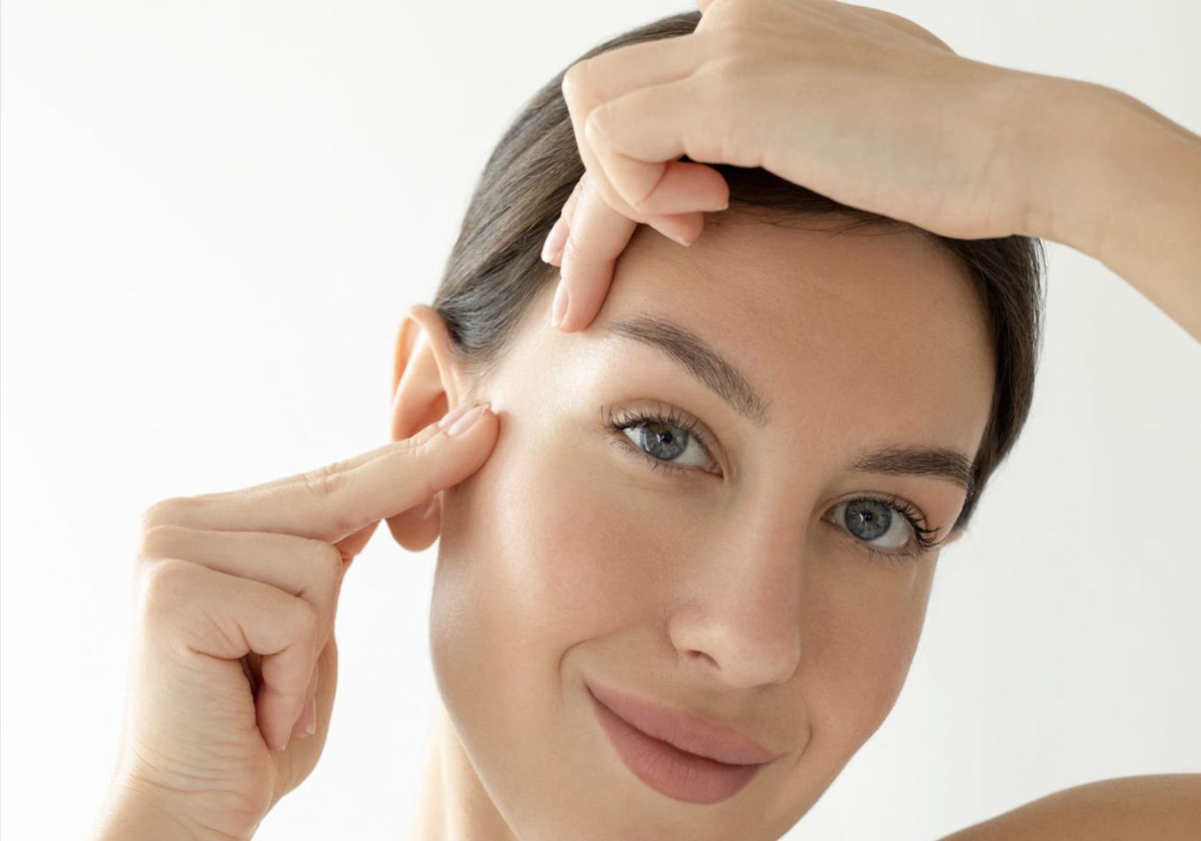 Student practicing facial yoga during a guided session